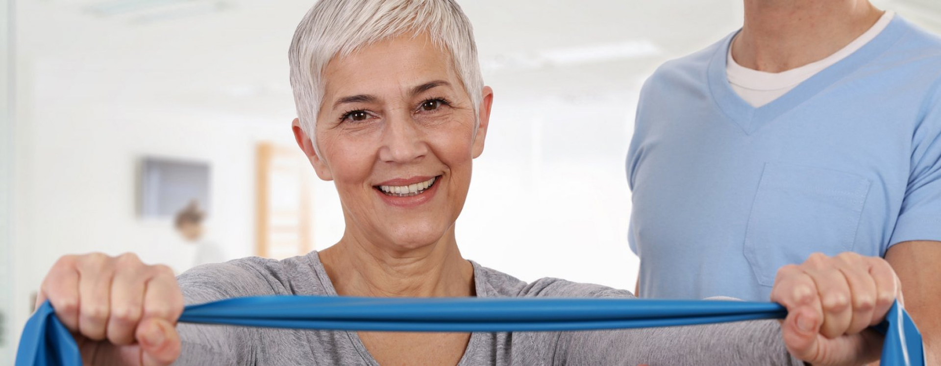 Woman smiling pulling ribbon
